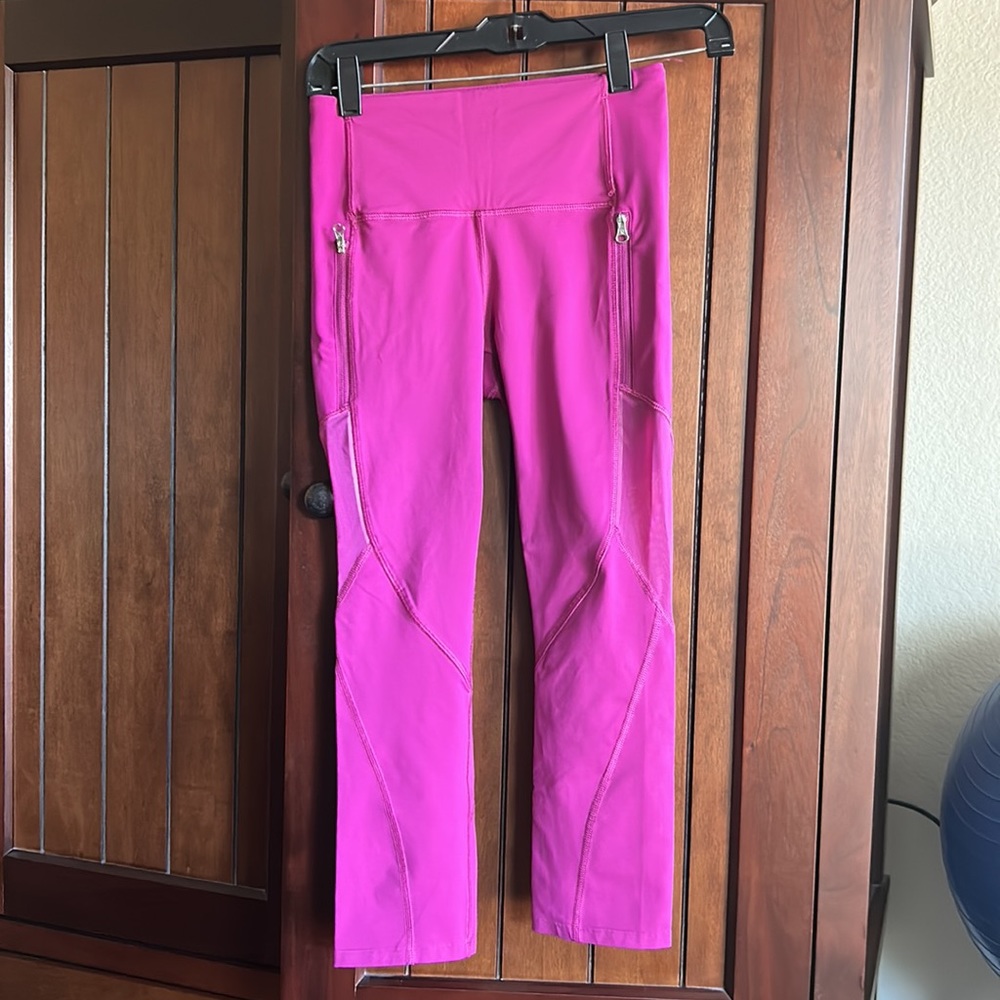 Lululemon leggings with zippers and cute sheer parts on the side and back.
